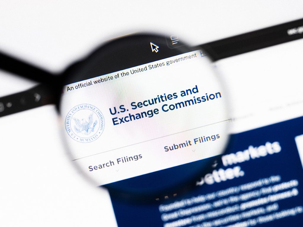 Closeup of Securities and Exchange Commission website on a laptop screen. Securities and Exchange Commission logo under a magnifying glass. Casimiro - stock.adobe.com