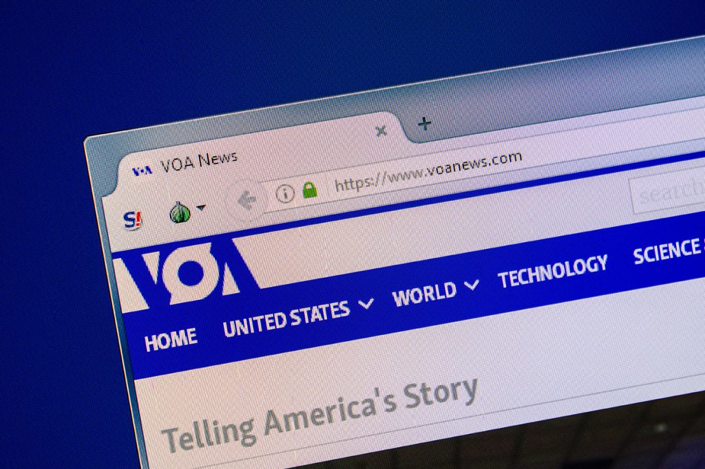 Homepage of VOAnews website on the display of PC.